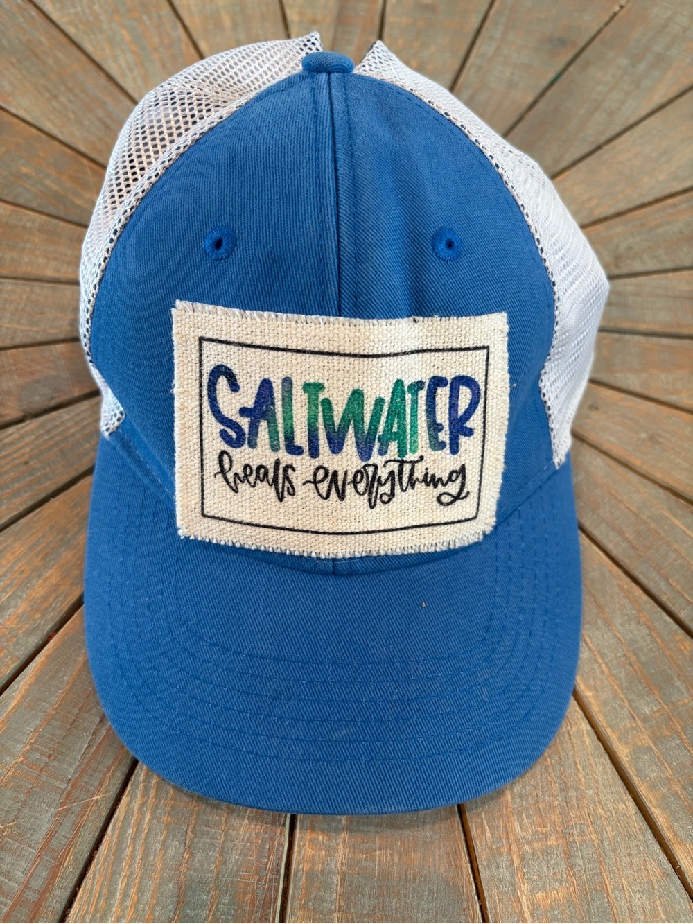 Women’s "Saltwater Heals Everything" Trucker Hat w/ponytail hole in the back